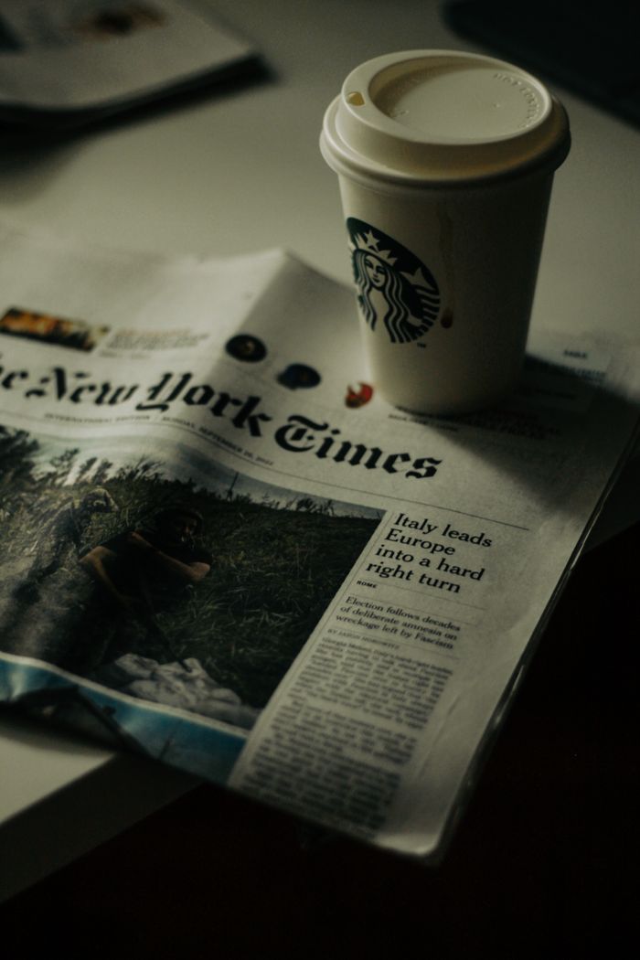 Vision Relax with a coffee and newspaper in a cozy New York setting. Perfect for morning routines.